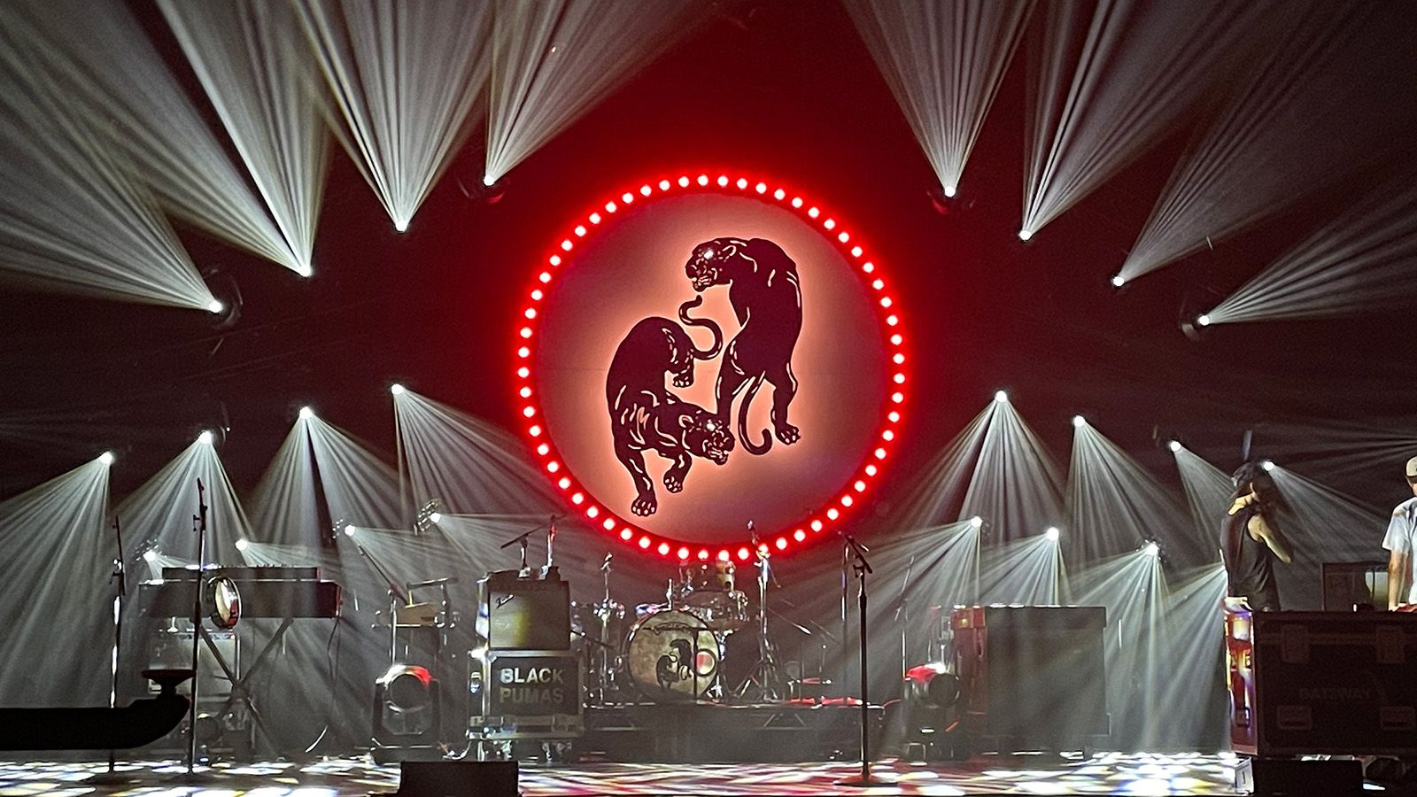 Black Pumas logo projected with bright circular KNV Dots